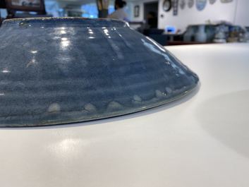 A Chinese monochrome blue Swatow dish with incised carp design, Ming